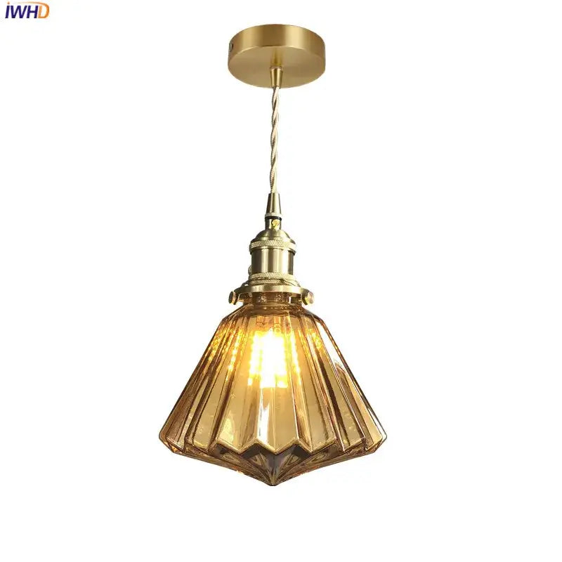 Modern diamond amber glass led pendant light with warm amber glass, brass-finished fixture, and twisted cord for dining room