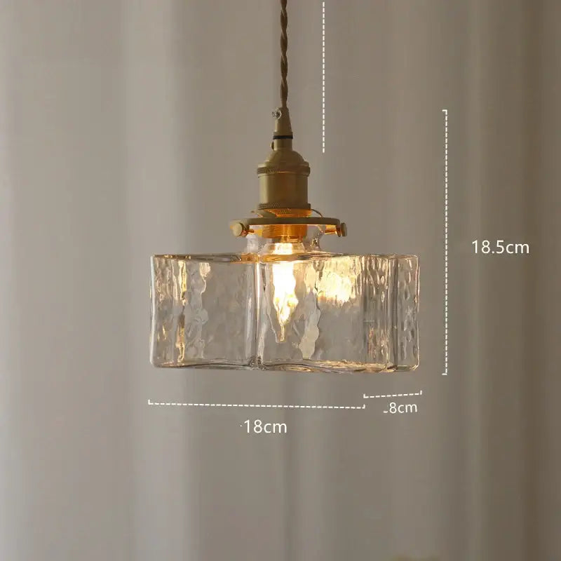 Modern diamond amber glass led pendant light featuring warm-toned textured amber glass and brass fixture for dining room