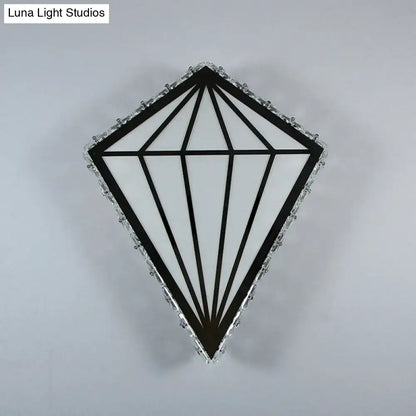 Modern diamond white wall light with black and white geometric design framed by crystal accents and warm white light bulb base