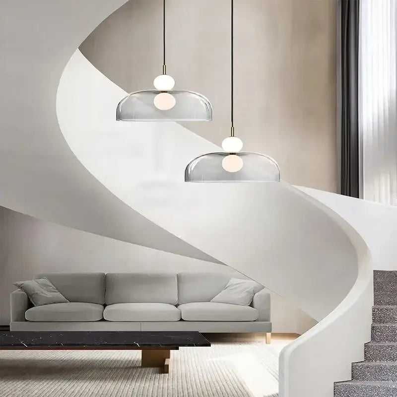 Modern double balls glass chandelier pendant light with frosted white spherical bulbs and black cords above living space