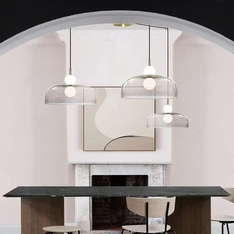 Three modern frosted white bulbs double balls glass pendant light hang in a minimalist kitchen dining space chandelier