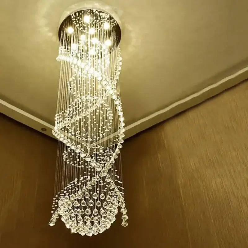 A modern double spiral crystal chandelier with clear faceted beads and metallic strands for hotel and villa living room