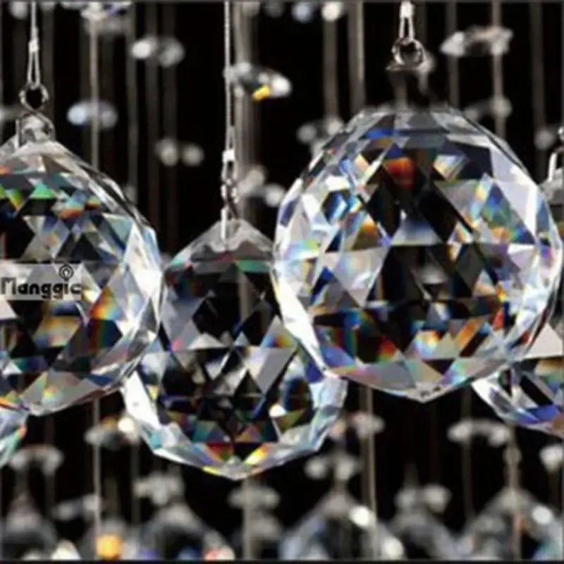 Modern double spiral crystal chandelier featuring clear faceted crystal spheres hanging from silver chains for villa staircase light