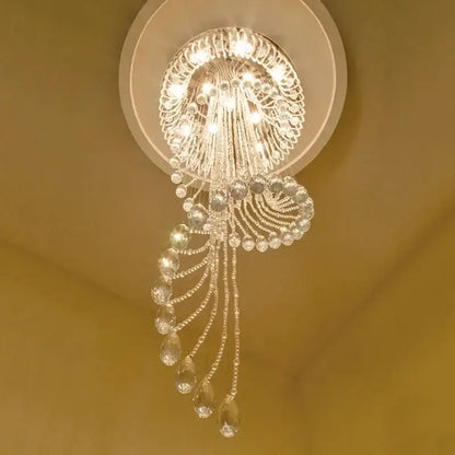 A sparkling crystal chandelier with teardrop crystals and ornate circular design for spiral staircase crystal ceiling