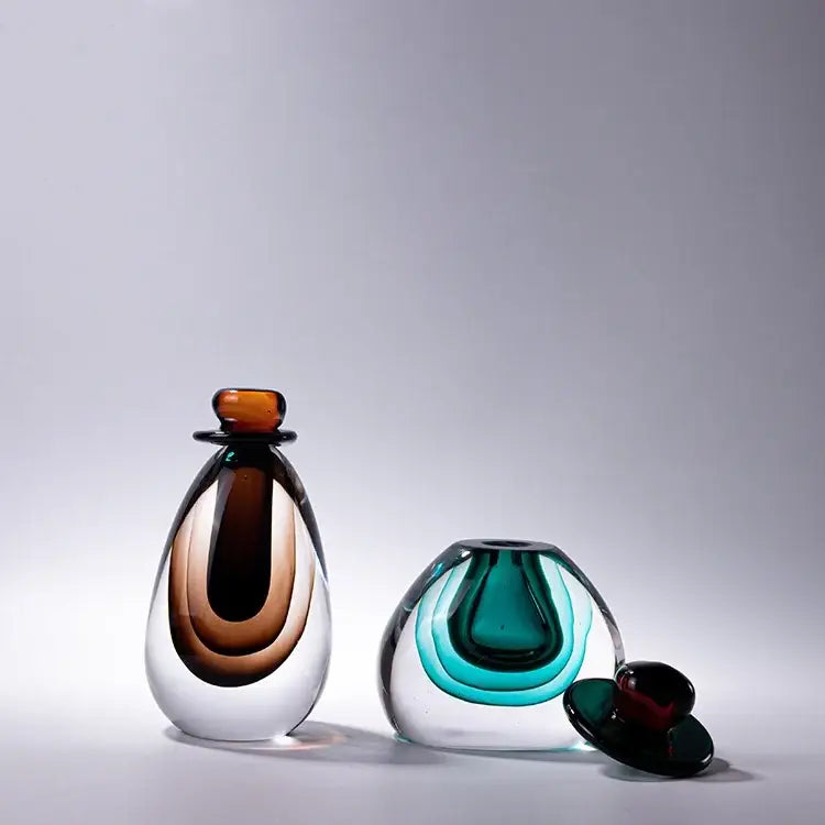 A sleek double stained glass vase with amber and clear layers designed as a modern living room terrarium