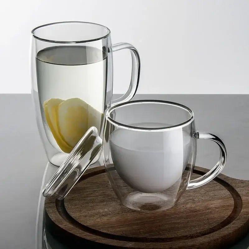 Clear double-walled glass mug with handle and lid containing lemon water for modern double wall beer whiskey wine use