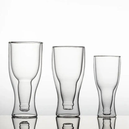 Three clear double wall mugs of varying heights with sleek modern design and subtle reflective bases for beer or wine