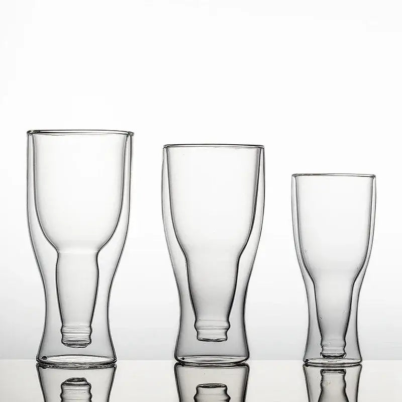 Three clear double wall mugs of varying heights with sleek modern design and subtle reflective bases for beer or wine