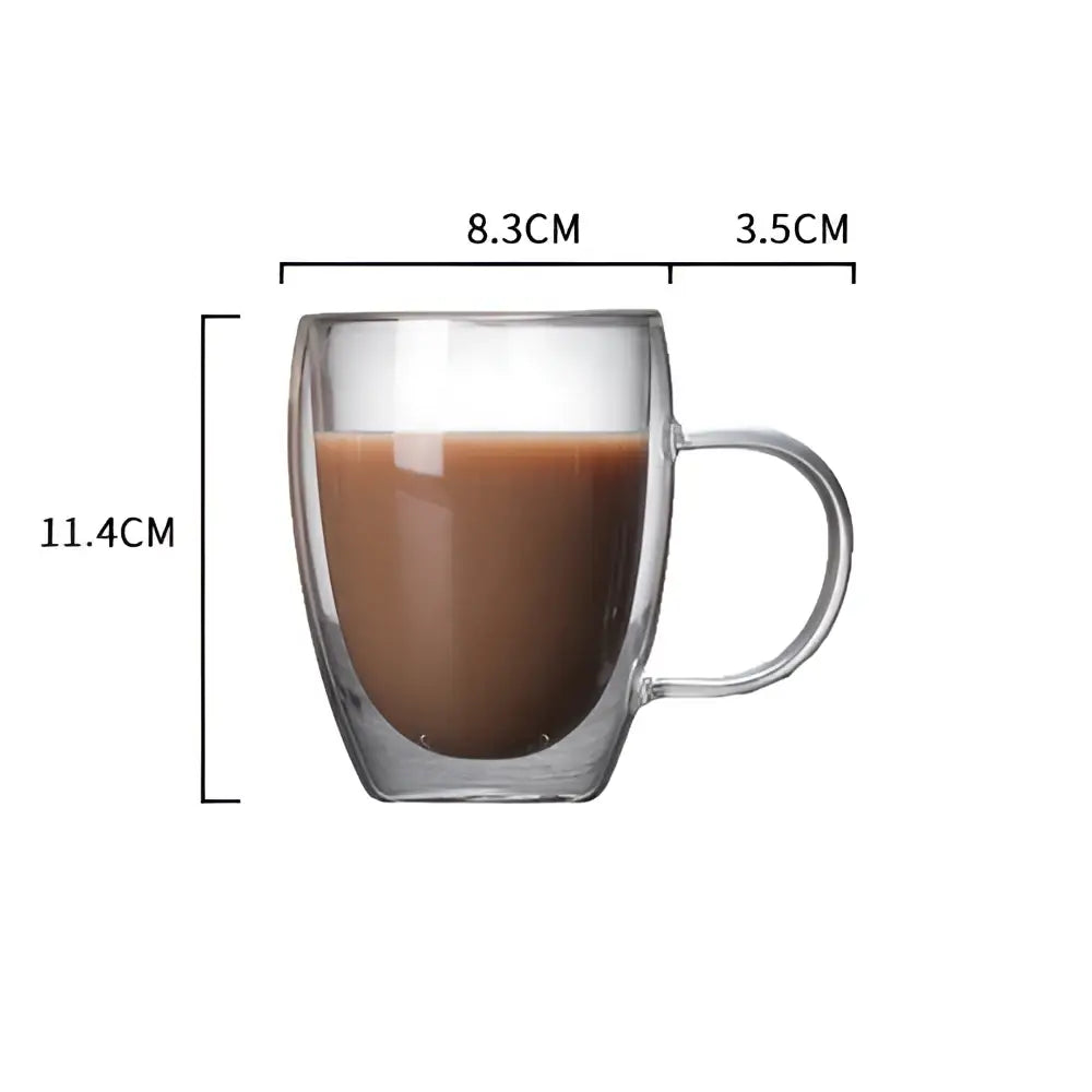 Modern double walled transparent glass cup filled with brown liquid featuring a handle for kitchen and dining use