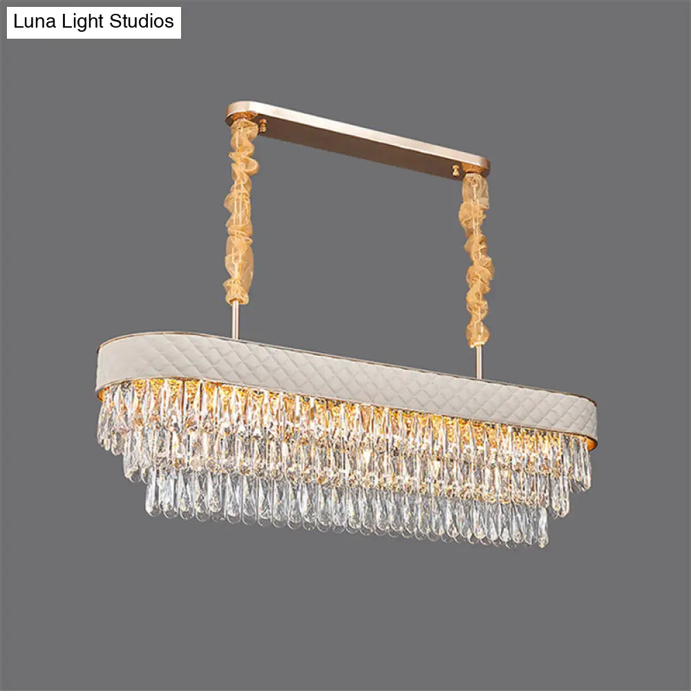 مصباح معلق على شكل أسطوانة كريستالية حديثة من DecorBites™ مزود بـ 12 رأسًا لغرفة الطعام