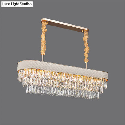 مصباح معلق على شكل أسطوانة كريستالية حديثة من DecorBites™ مزود بـ 12 رأسًا لغرفة الطعام