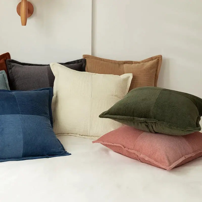 A collection of modern earth tone decorbites corduroy pillow covers in patchwork design for living room decor