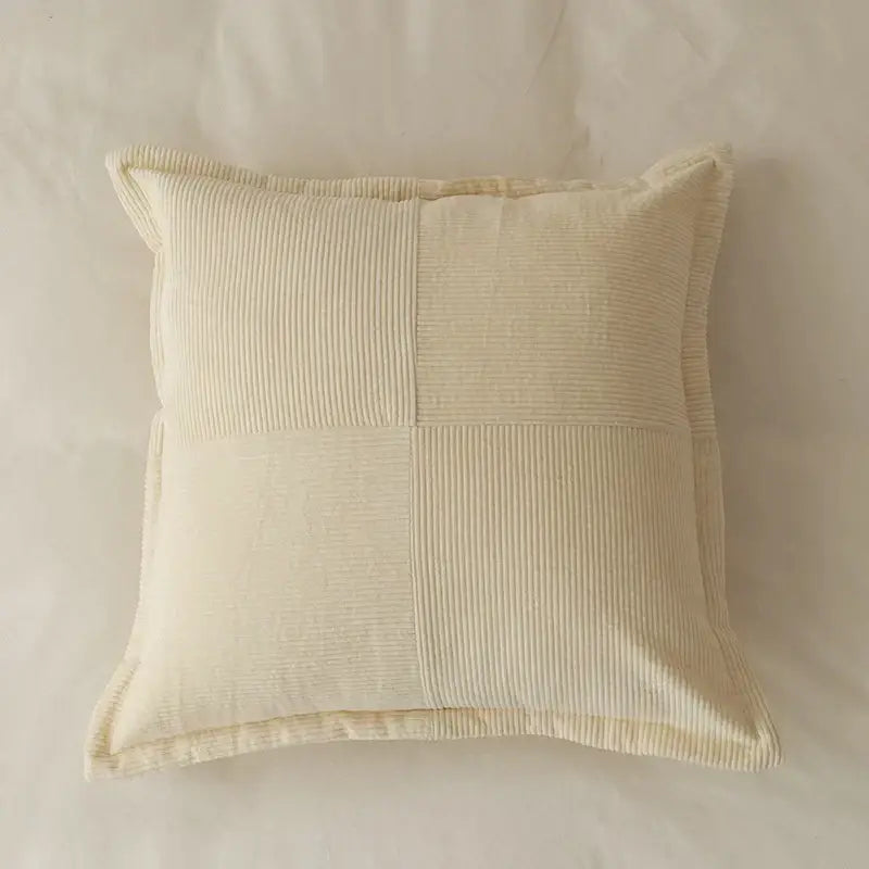 Cream-colored corduroy pillow cover with quilted patchwork design for modern earth tone living room decorbites cushion