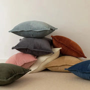 Stack of modern earth tone corduroy pillow covers in muted tones as decorbites corduroy pillow decor for living room