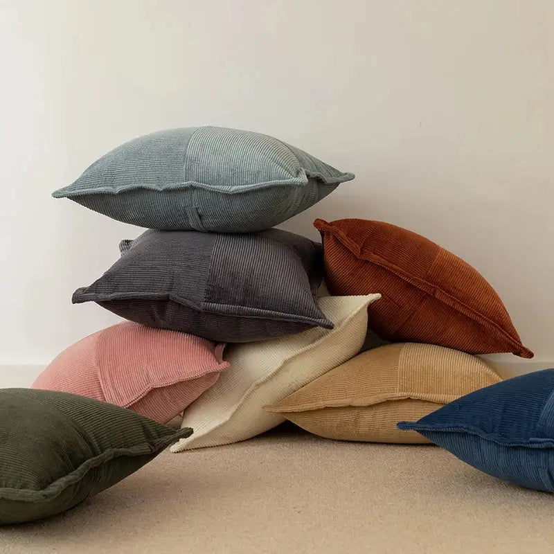 Stack of modern earth tone corduroy pillow covers in muted tones as decorbites corduroy pillow decor for living room