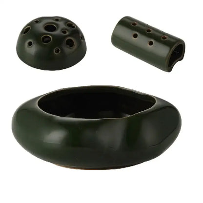 Dark green lotus seedpod ceramic ocarina incense burner with rounded body perforated dome lid for living room decor