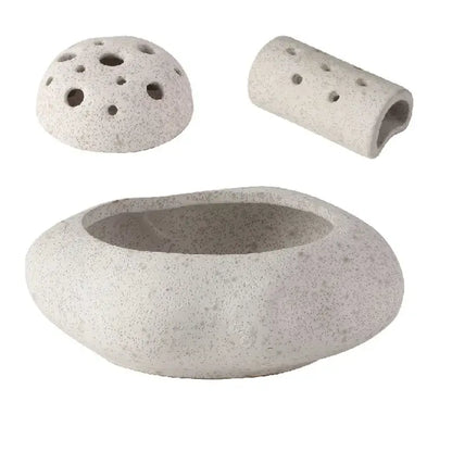 Modern earthy lotus seedpod ceramic incense burner with light gray speckled stone, rounded base, and perforated dome lid