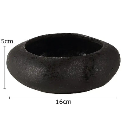 Matte black lotus seedpod ceramic incense burner bowl with textured surface and raised rim for living room decor