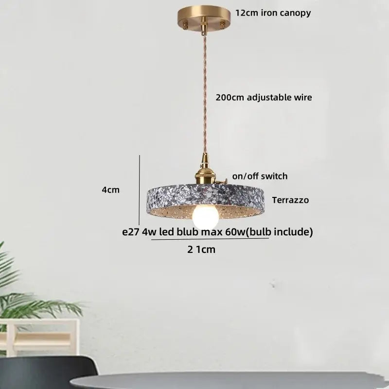 Modern earthy terrazzo stone led pendant light with circular design brass iron canopy and adjustable wire for dining room decorbites terrazzo stone