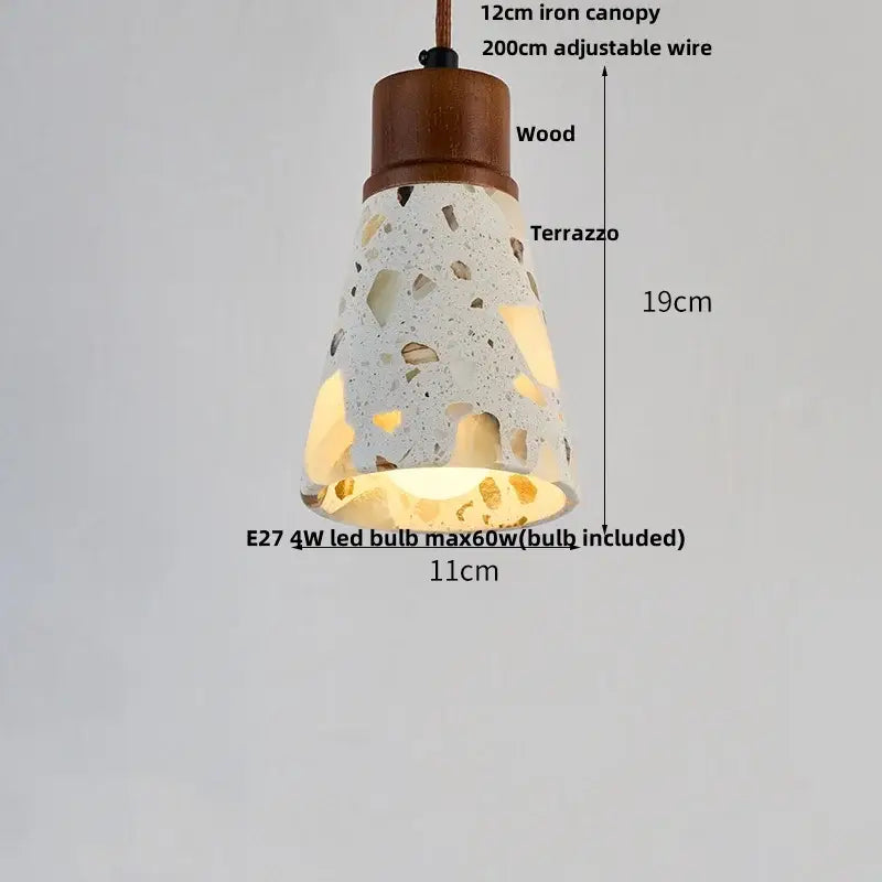 A modern pendant light with a terrazzo stone led cone shade and wooden canopy from decorbites for dining room decor