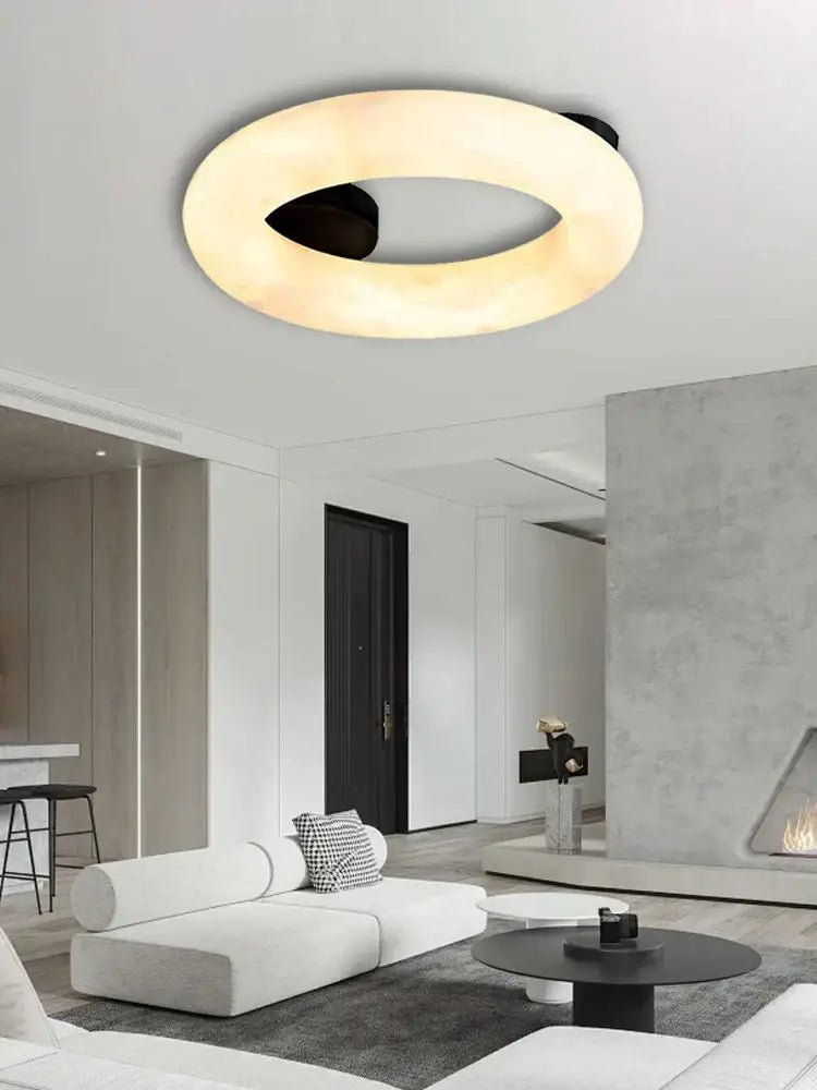 Modern elegant alabaster marble ceiling chandelier with warm diffused glow and sleek black inner ring for living room