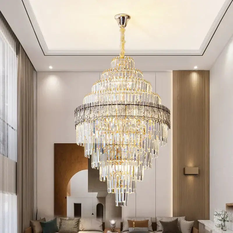 Modern elegant crystal chandelier with gold-toned frame and cascading clear glass prisms for decorbites elegant crystal decor