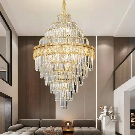 Modern elegant crystal chandelier with gold-toned metal and cascading clear glass prisms by decorbites elegant crystal