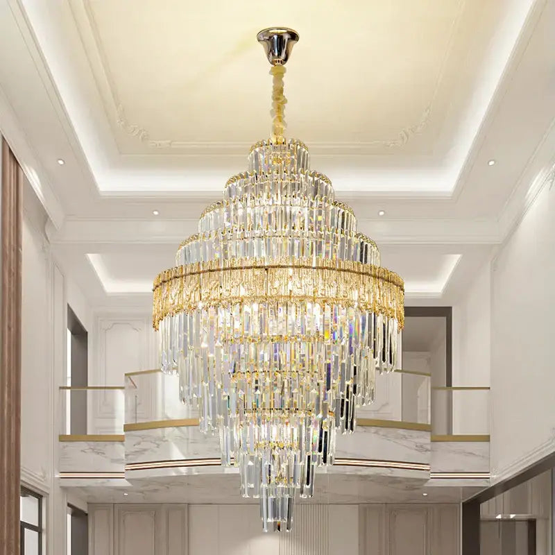 Modern elegant crystal chandelier with gold-toned metal and clear glass prisms for dining room decorbites elegant crystal