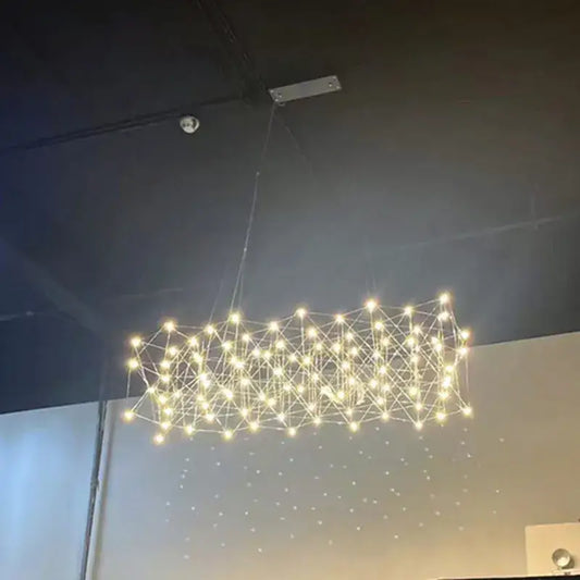 A modern elegant stainless steel geometric led chandelier with warm white lights for dining room decorbites elegant stainless