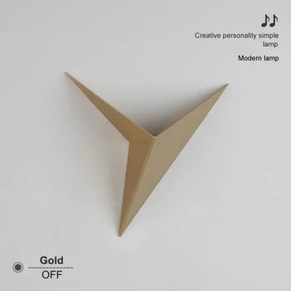 Modern elegant triangular led wall lamp in gold with sleek geometric design perfect for bedroom or study decorbites elegant triangular wall lamp
