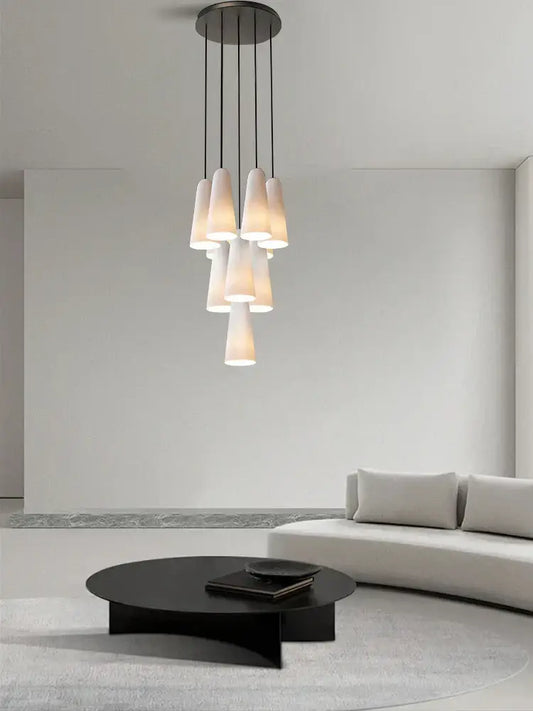 Modern pendant chandelier with elegant white glass cup shades and sleek black metal frame for living room decorbites elegant white