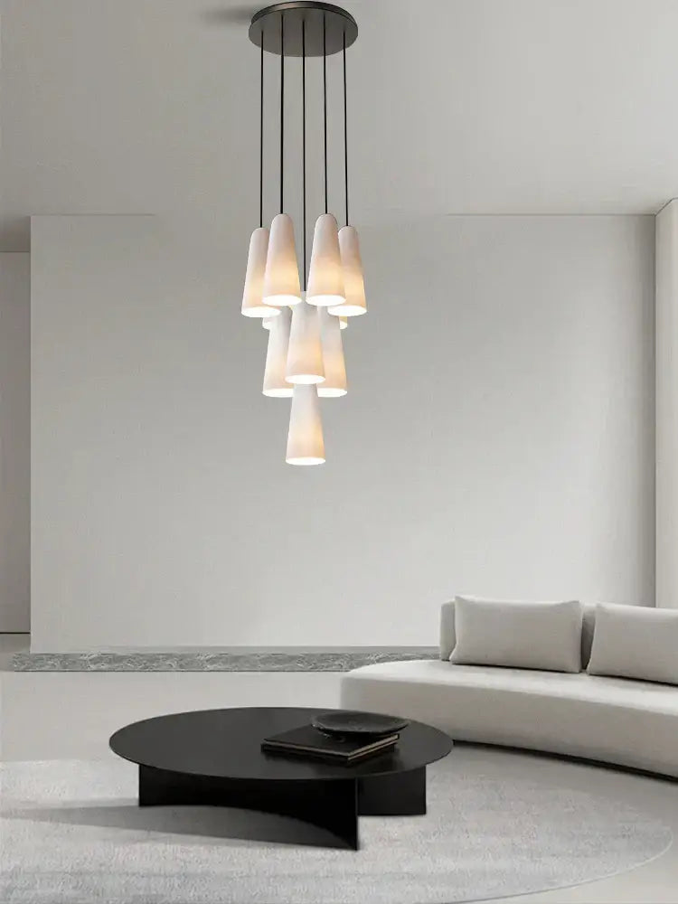 Modern pendant chandelier with elegant white glass cup shades and sleek black metal frame for living room decorbites elegant white