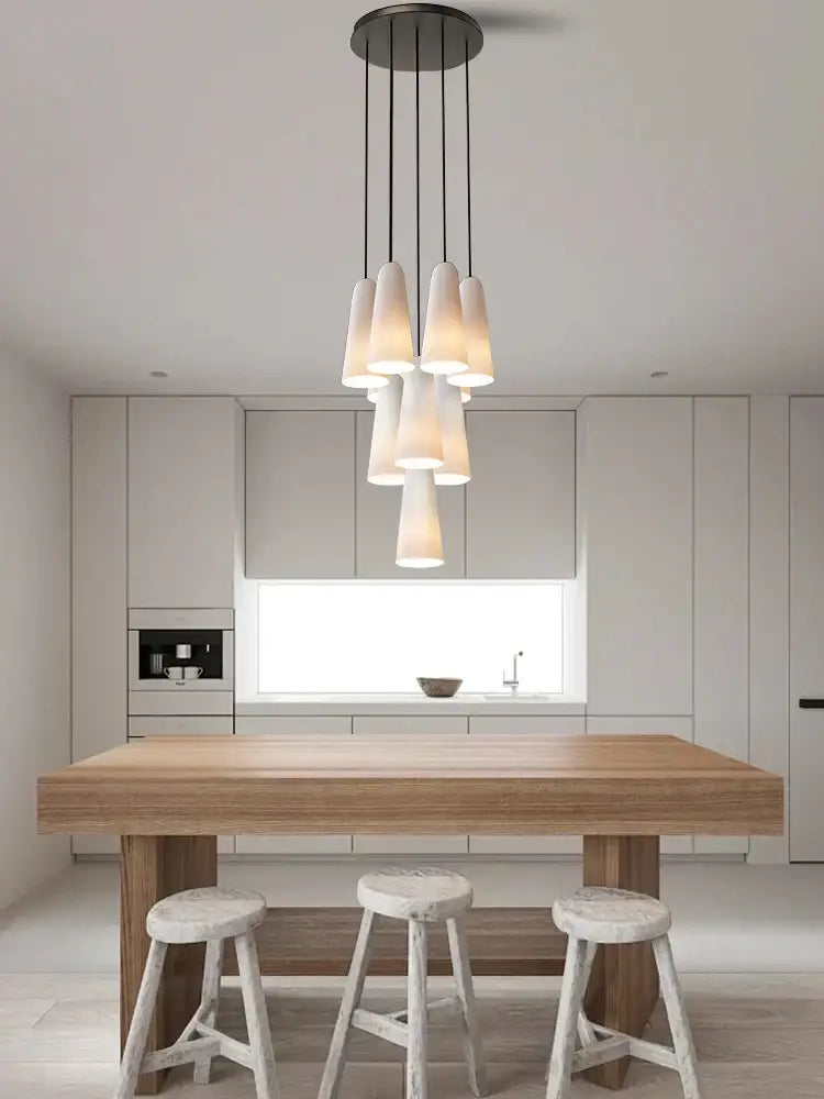 Modern elegant white glass cup chandelier pendant light with multiple frosted shades on dark metal decorbites elegant white fixture