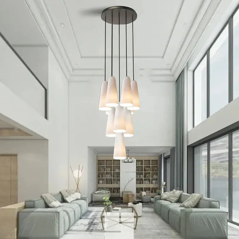 Modern pendant chandelier with multiple frosted elegant white glass cup shades on dark metal base for living room decorbites elegant white