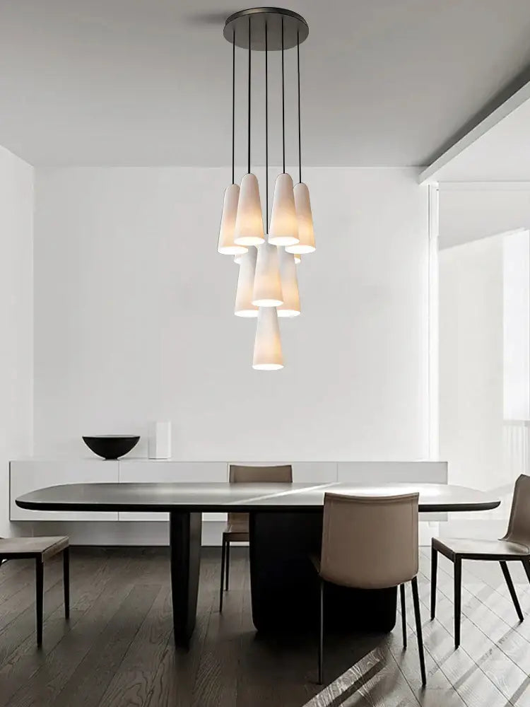 Modern minimalist pendant light with multiple frosted white glass cup shades from decorbites elegant white chandelier
