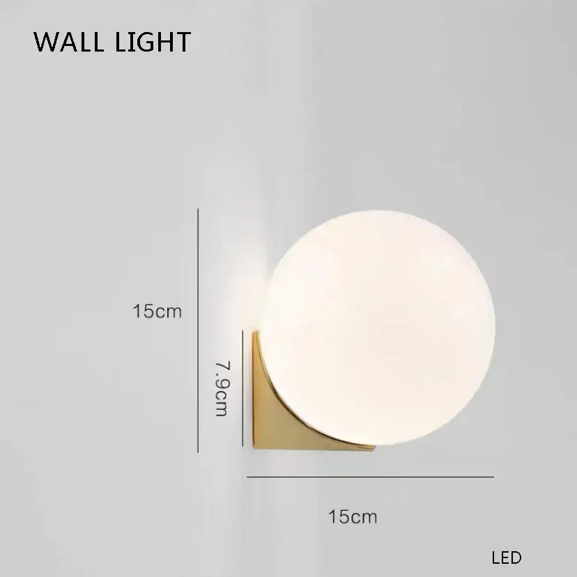 Modern elegant white glass cup chandelier pendant light with a matte white glass globe and brushed gold bracket decorbites elegant white