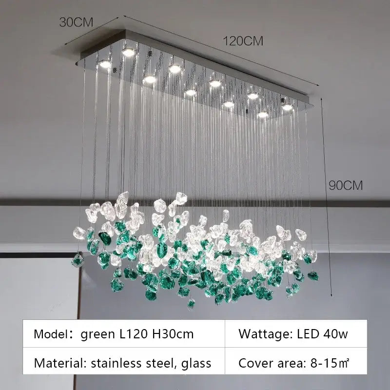 A modern rectangular glass stone chandelier with stainless steel frame and cascading clear and emerald green glass crystals