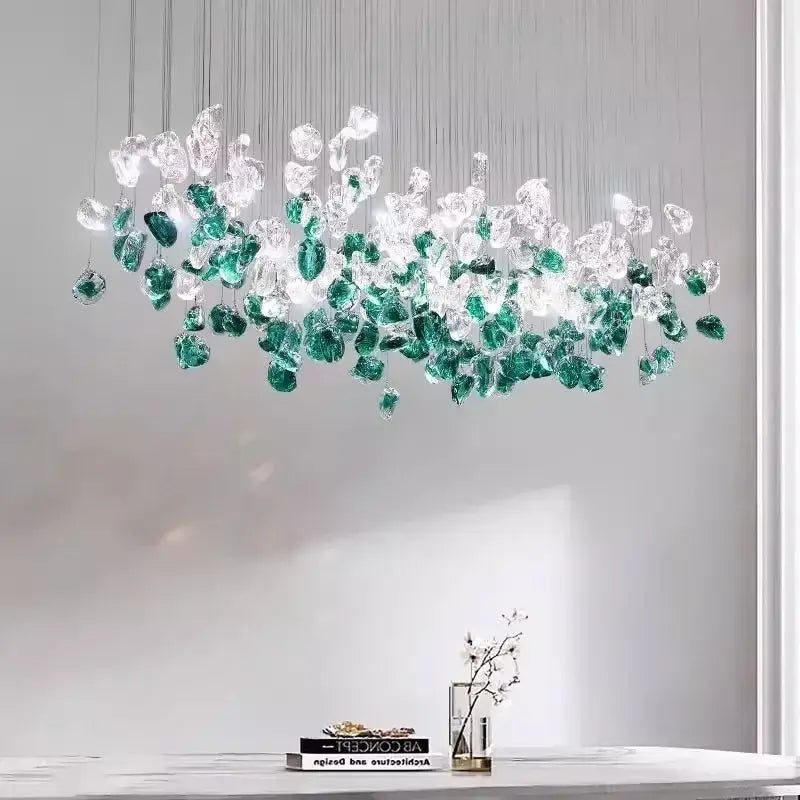 A modern emerald and clear glass stone chandelier with cascading glass pieces for dining room decorbites glass stone decor