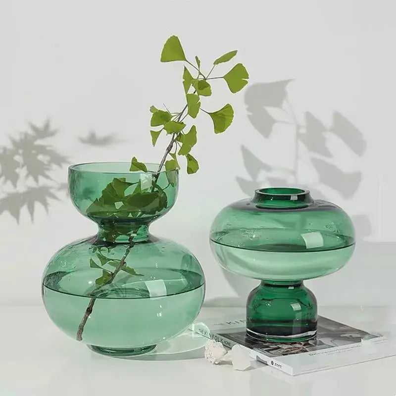 Two translucent green glass green gourd vases with rounded double-bulb design for modern living room decor