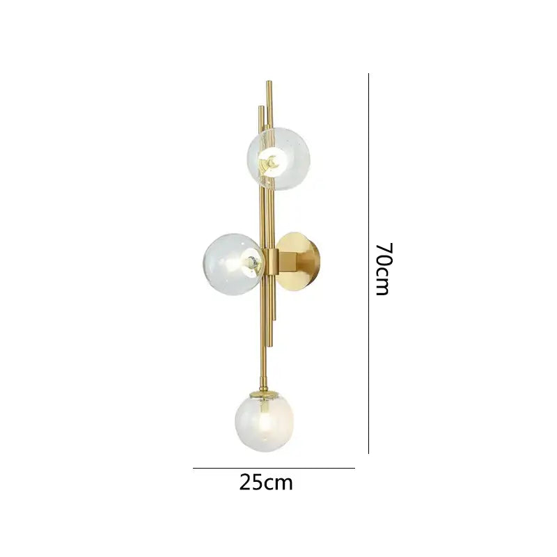 Modern emerald green white glass ball wall lamps featuring a gold-toned wall sconce with three clear glass globes