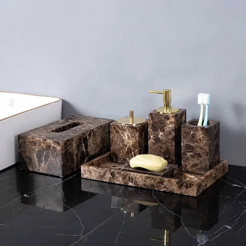 Modern emperador dark marble bathroom accessory set with gold-tone pump and lid accents in dark marble design
