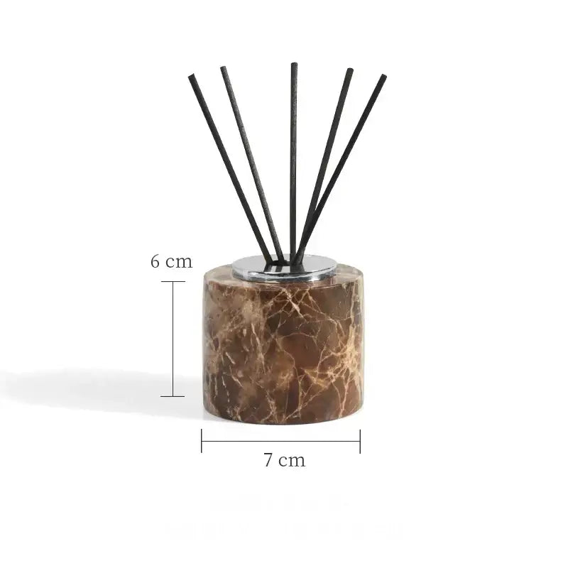 Brown marble reed diffuser with silver metal base and six black reeds from modern emperador dark marble bathroom set