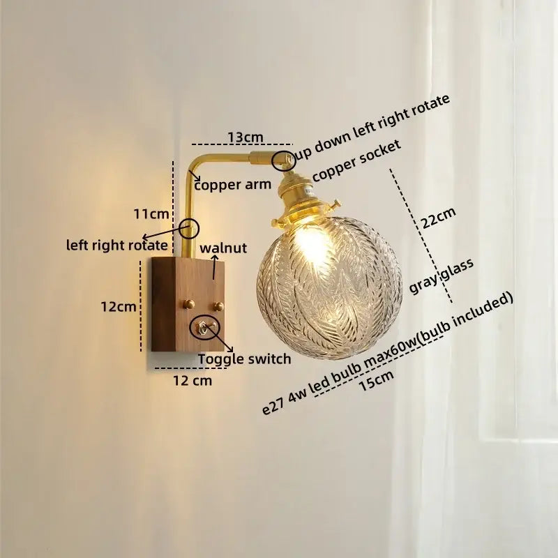 Modern etched glass copper led wall lights with brass copper arm, walnut base, and ornate gray leaf-etched globe for bedroom