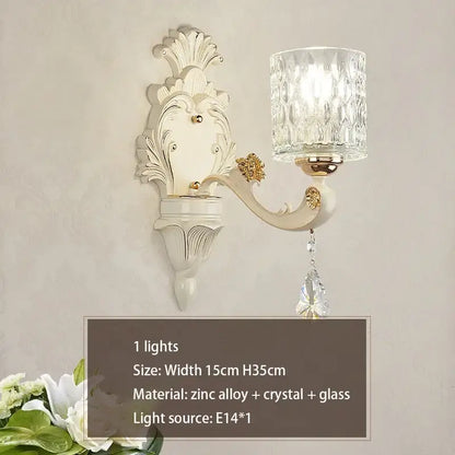 Elegant off-white ornate wall sconce with faceted crystal glass shade and gold accents for decorbites crystal ceiling decor