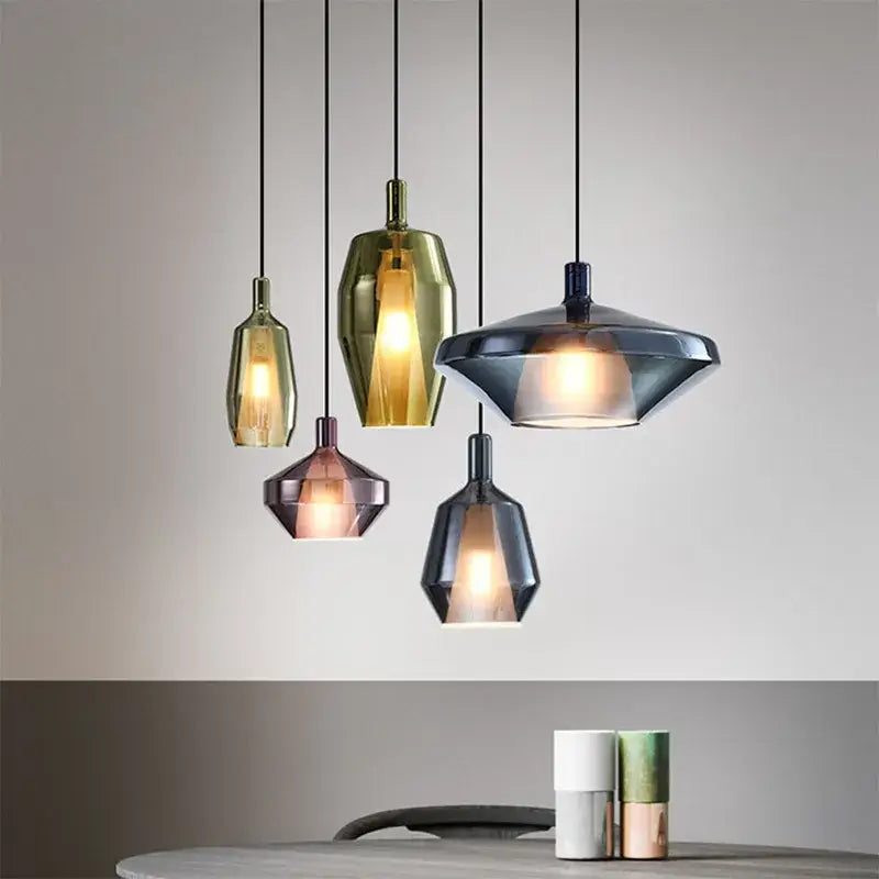 Set of five modern faceted glass pendant lights in gold rose gold and dark gray for home art decor and dining room use