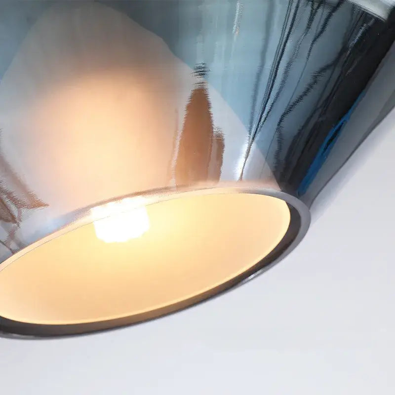 Modern faceted glass pendant lights with shiny chrome finish and warm diffused glow for home art decor and dining room