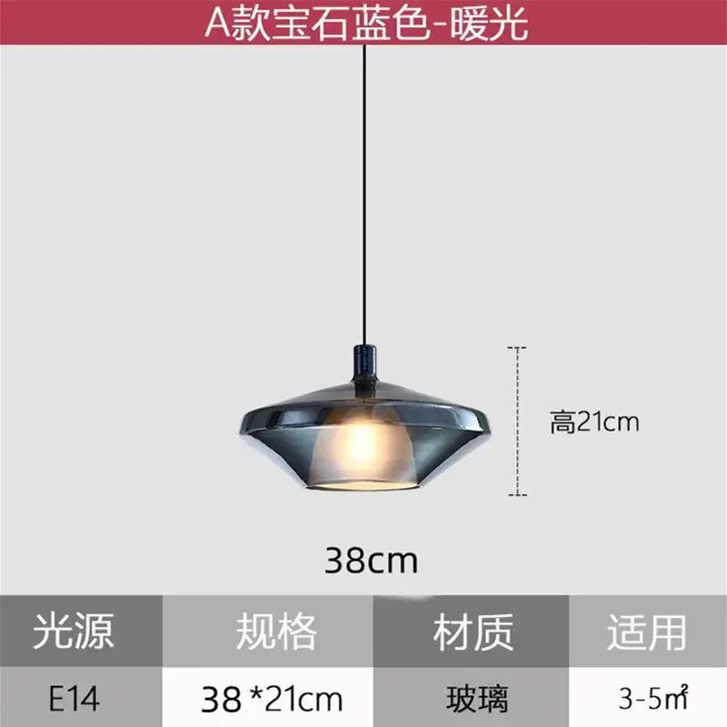 A sleek dark blue glass pendant light with a modern flared design and warm glow for home art decor