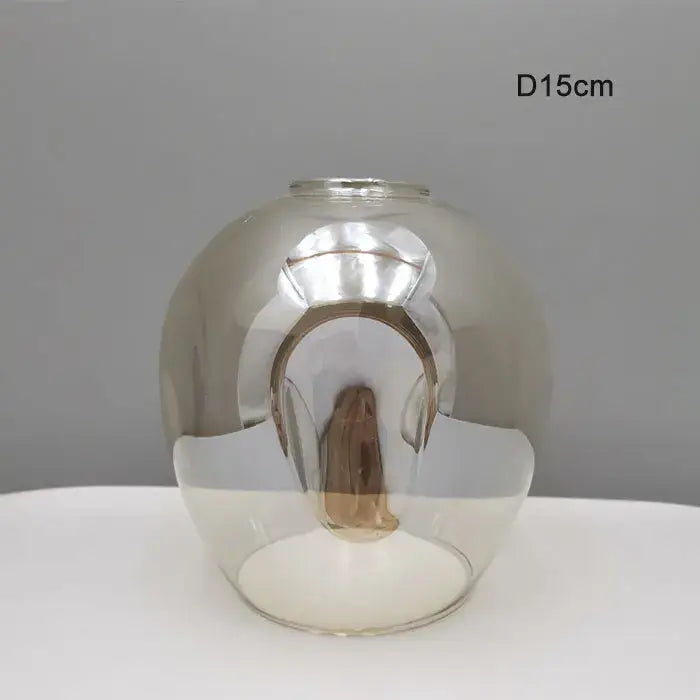 Modern faceted glass shade replacement with reflective silver interior and transparent exterior for living room lamp cover