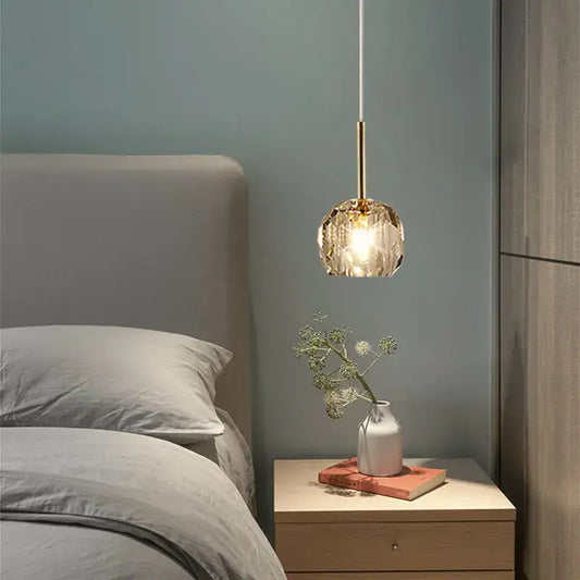 Modern faceted gold glass pendant light with slender brass stem and led bulb for bedroom cord pendant installation