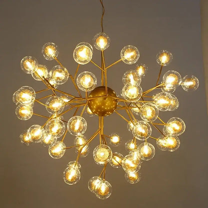 Modern firefly glass round ball chandelier with golden spherical metal and clear glass globe bulbs for dining room decorbites heracleum firefly